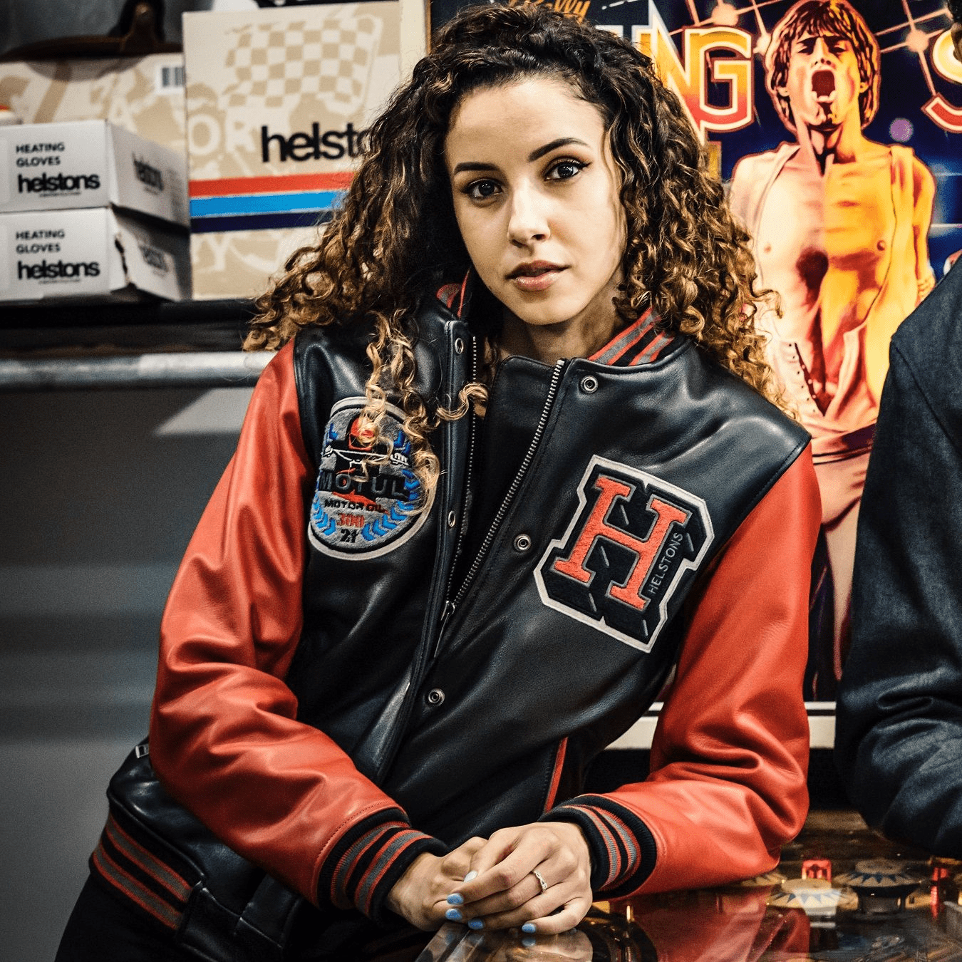 207845 The iconic American college jacket, infused with the expertise of Helstons' designer and adorned with Motul's Heritage 300 2T oil logo, has transformed into a motorcycle protective gear.